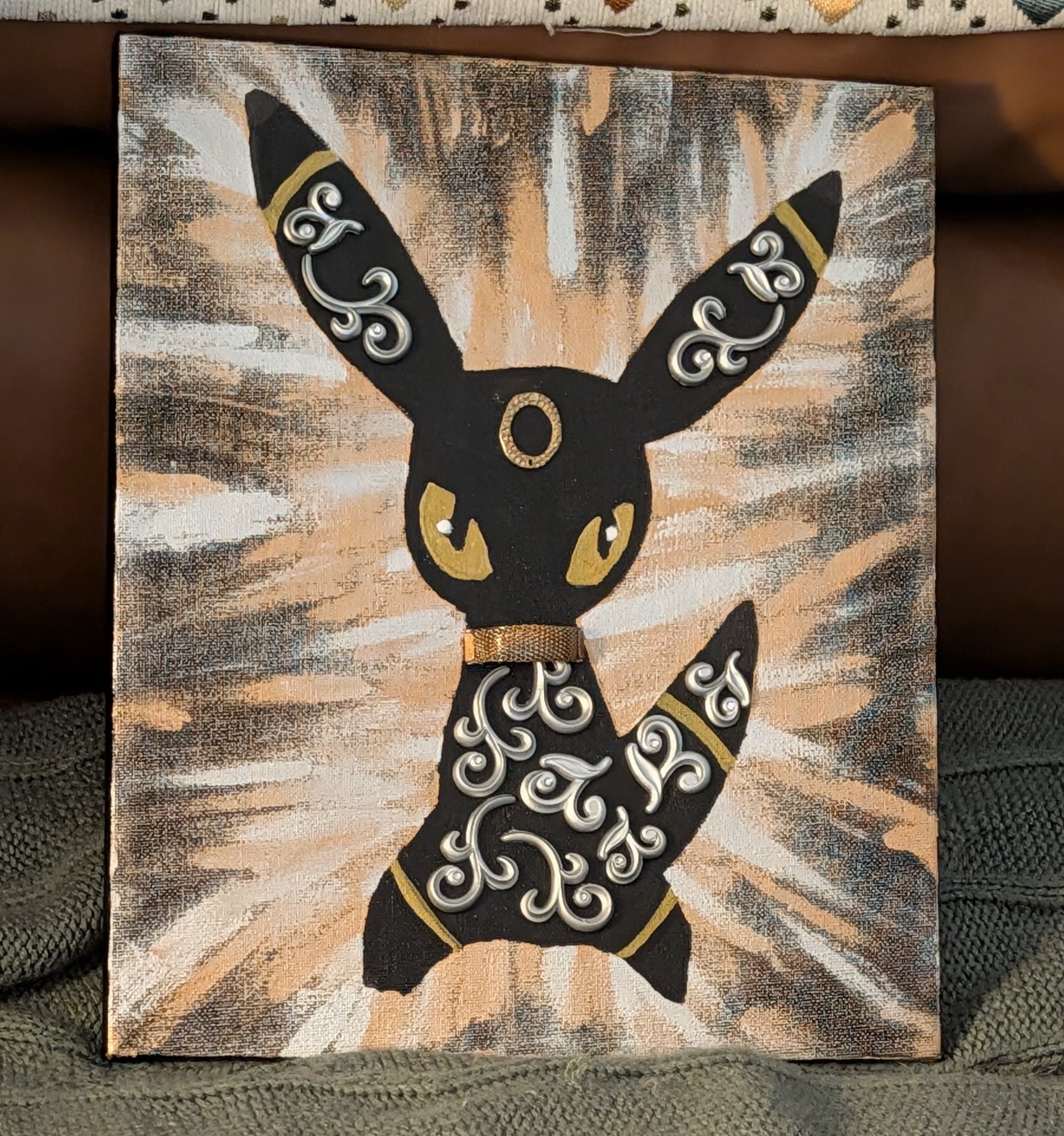 Two cats in herringbone pattern — black on rose and gold on teal