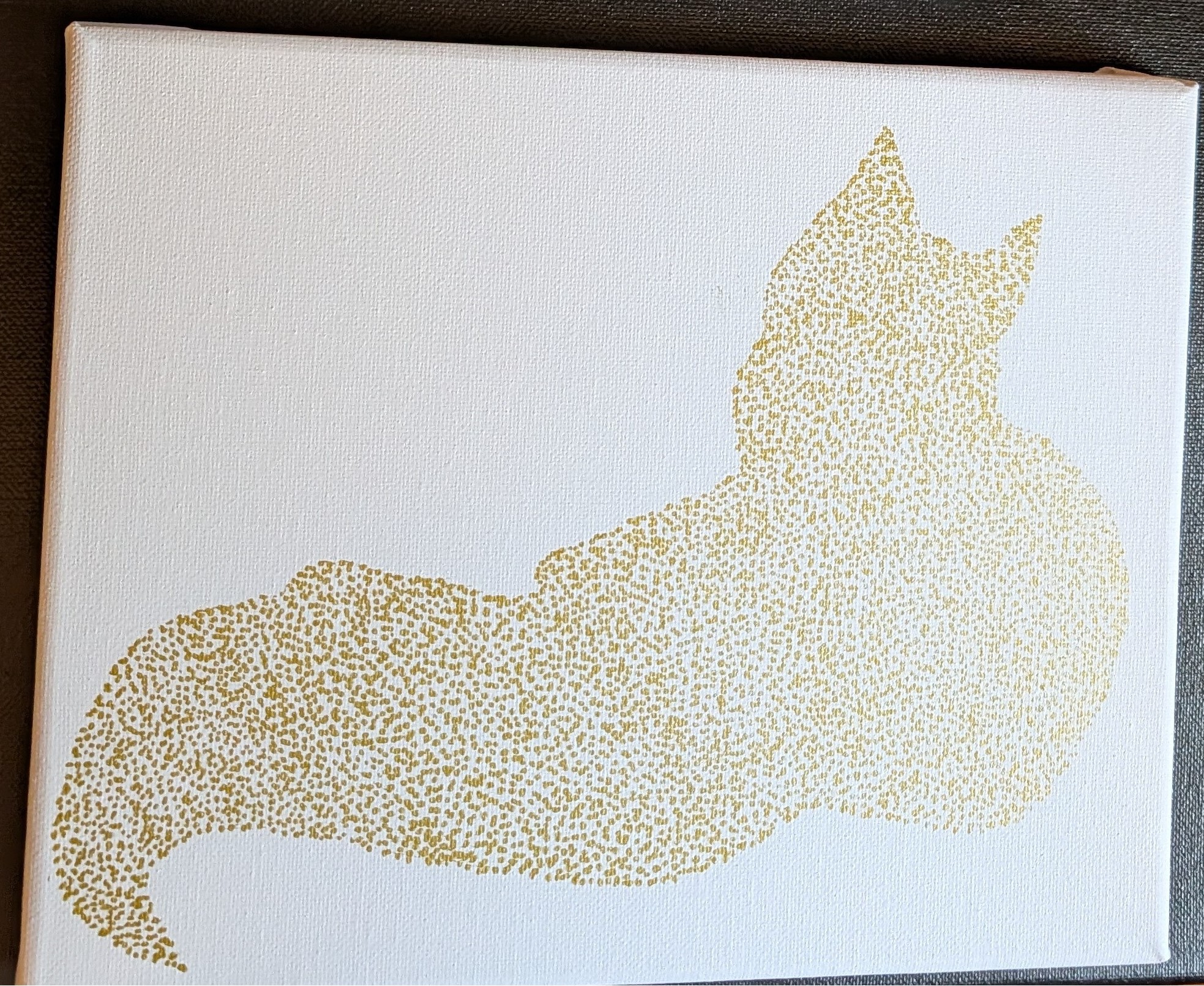 Cat silhouette in gold stippling on white canvas
