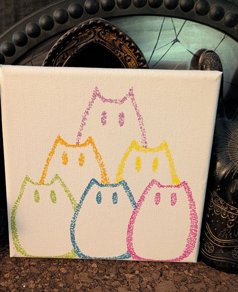 Five cat outlines in pink green yellow blue and orange on white