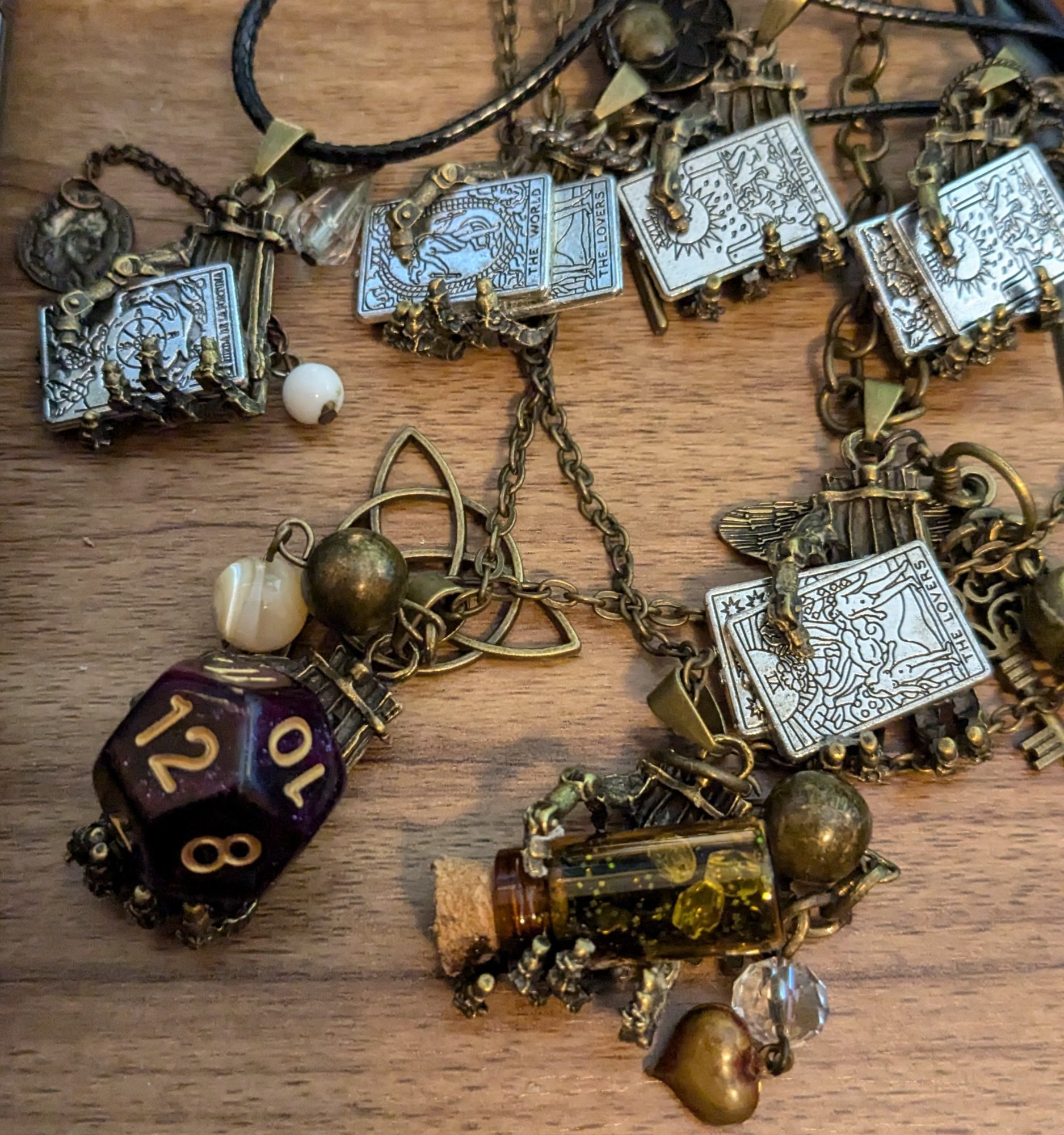 Tarot card charm bracelet with potion bottle and d12