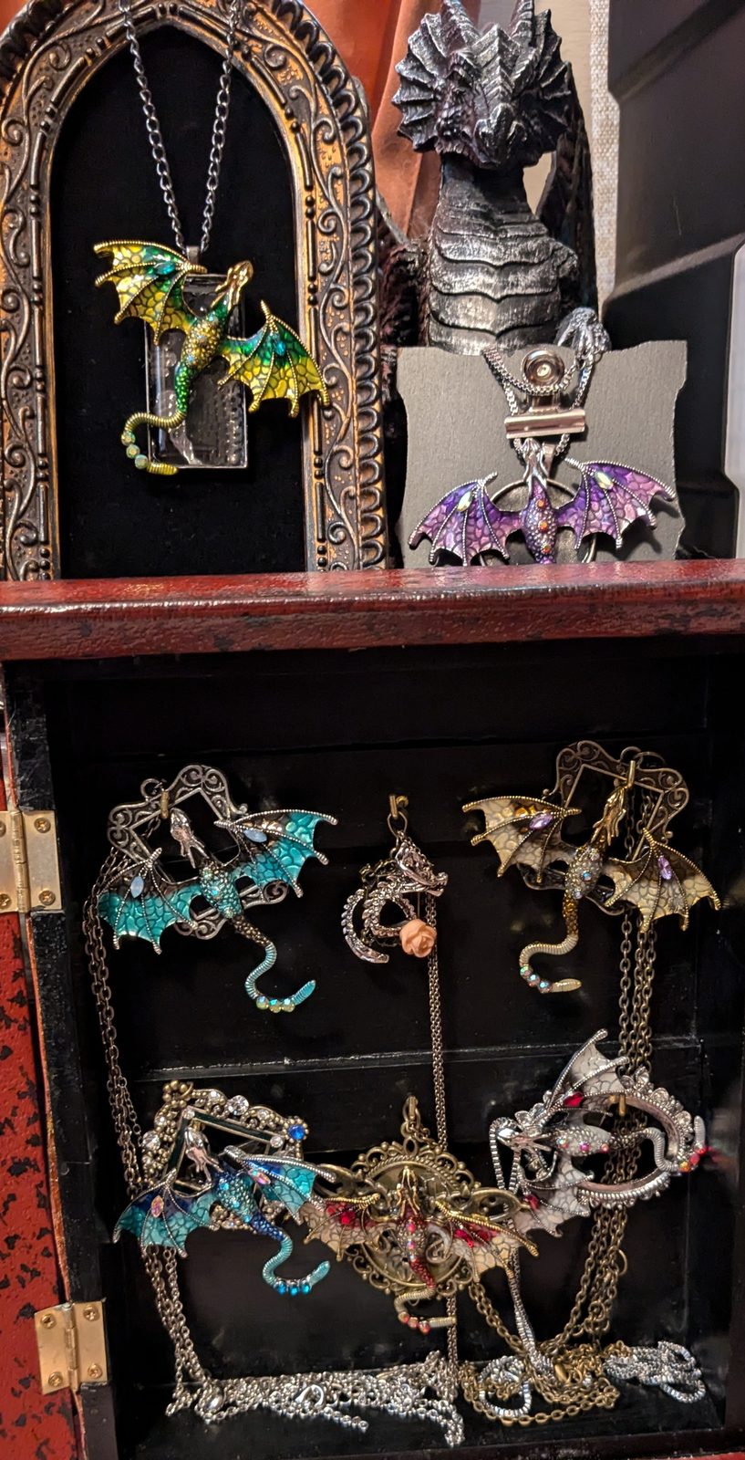 A display of dragon pendants and charms